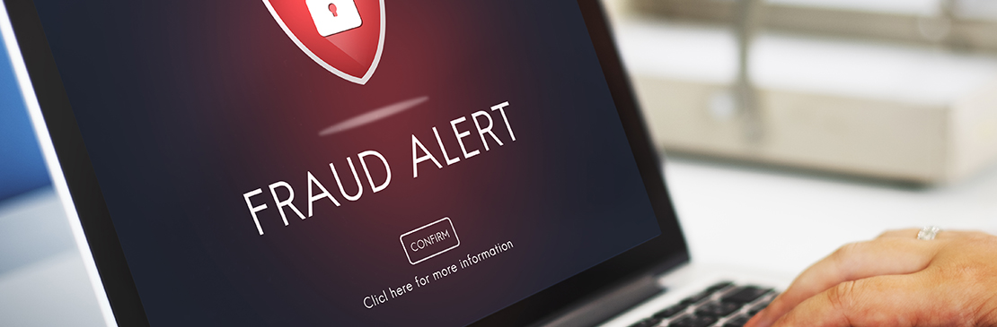 image of lap tap with fraud alert on it